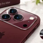 Burgundy iPhone 18 Pro Max with a clear camera lens protector installed over the rear triple-camera lenses