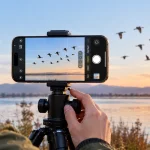 iPhone 18 Pro Max taking a landscape photo at golden hour